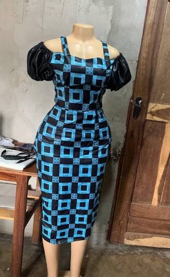 Checkered black and turquoise midi dress product photo used to generate a FashionUGC video